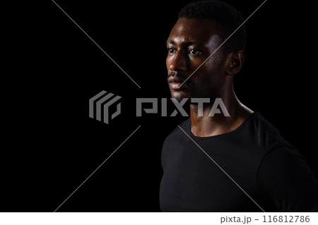 African American man in contemplative pose, with copy space on black background African American man in contemplative pose, with copy space on black background 116812786