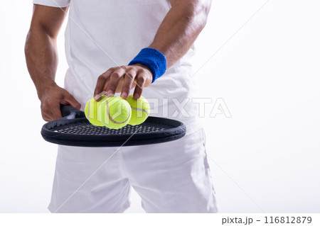 Athlete preparing for a tennis match on white background, with copy space Athlete preparing for a tennis match on white background, with copy space 116812879