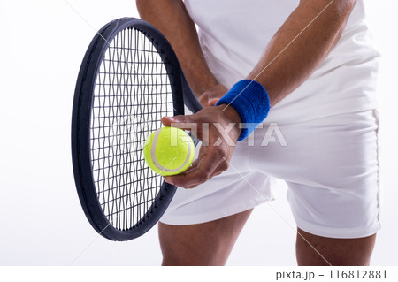 Tennis player preparing to serve on a white background 116812881