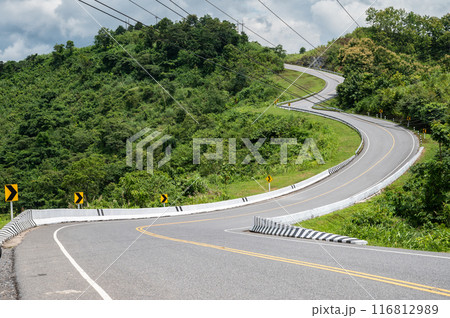 Beautiful steep curved road (look like number 3) on the high mountain in Nan province, Thailand. An iconic tourist attraction place on the way to Bo Kluea (means salt well) district. 116812989