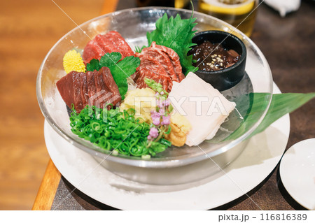horse meat pieces sashimi or Japanese Basashi. Baniku includes lean meat, superb marbling, mane and liver. Premium meat and famous food in Matsumoto city, Nagano Prefecture, Japan horse meat pieces sashimi or Japanese Basashi. Baniku includes lean meat, superb marbling, mane and liver. Premium meat and famous food in Matsumoto city, Nagano Prefecture, Japan 116816389
