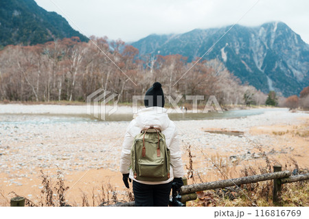 Woman tourist travel Kamikochi National Park, happy Traveler sightseeing Azusa river with mountain, Nagano Prefecture, Japan. Landmark for tourists attraction. Japan Travel, Destination and Vacation Woman tourist travel Kamikochi National Park, happy Traveler sightseeing Azusa river with mountain, Nagano Prefecture, Japan. Landmark for tourists attraction. Japan Travel, Destination and Vacation 116816769