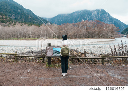 Woman tourist travel Kamikochi National Park, happy Traveler sightseeing Azusa river with mountain, Nagano Prefecture, Japan. Landmark for tourists attraction. Japan Travel, Destination and Vacation Woman tourist travel Kamikochi National Park, happy Traveler sightseeing Azusa river with mountain, Nagano Prefecture, Japan. Landmark for tourists attraction. Japan Travel, Destination and Vacation 116816795