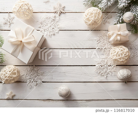 白い木の板に置かれた白いプレゼントとクリスマスの飾り 116817010