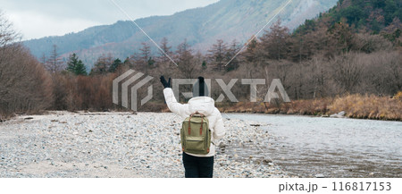 Woman tourist travel Kamikochi National Park, happy Traveler sightseeing Azusa river with mountain, Nagano Prefecture, Japan. Landmark for tourists attraction. Japan Travel, Destination and Vacation Woman tourist travel Kamikochi National Park, happy Traveler sightseeing Azusa river with mountain, Nagano Prefecture, Japan. Landmark for tourists attraction. Japan Travel, Destination and Vacation 116817153