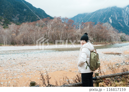 Woman tourist travel Kamikochi National Park, happy Traveler sightseeing Azusa river with mountain, Nagano Prefecture, Japan. Landmark for tourists attraction. Japan Travel, Destination and Vacation Woman tourist travel Kamikochi National Park, happy Traveler sightseeing Azusa river with mountain, Nagano Prefecture, Japan. Landmark for tourists attraction. Japan Travel, Destination and Vacation 116817159