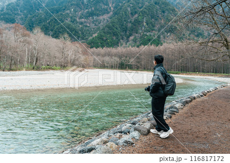 man tourist travel Kamikochi National Park, happy Traveler sightseeing Azusa river with mountain, Nagano Prefecture, Japan. Landmark for tourists attraction. Japan Travel, Destination and Vacation man tourist travel Kamikochi National Park, happy Traveler sightseeing Azusa river with mountain, Nagano Prefecture, Japan. Landmark for tourists attraction. Japan Travel, Destination and Vacation 116817172
