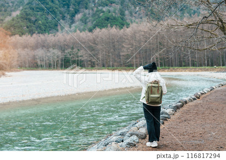 Woman tourist travel Kamikochi National Park, happy Traveler sightseeing Azusa river with mountain, Nagano Prefecture, Japan. Landmark for tourists attraction. Japan Travel, Destination and Vacation Woman tourist travel Kamikochi National Park, happy Traveler sightseeing Azusa river with mountain, Nagano Prefecture, Japan. Landmark for tourists attraction. Japan Travel, Destination and Vacation 116817294