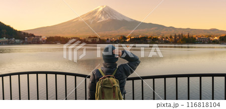 Woman tourist with Fuji Mountain at Lake Kawaguchi, happy Traveler sightseeing Mount Fuji in Fujikawaguchiko, Yamanashi, Japan. Landmark for tourists attraction. Japan Travel, Destination and Vacation Woman tourist with Fuji Mountain at Lake Kawaguchi, happy Traveler sightseeing Mount Fuji in Fujikawaguchiko, Yamanashi, Japan. Landmark for tourists attraction. Japan Travel, Destination and Vacation 116818104
