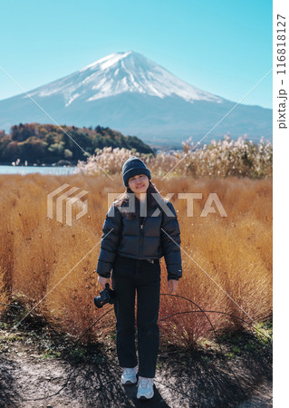Woman tourist with Fuji Mountain at Lake Kawaguchi, happy Traveler sightseeing Mount Fuji in Fujikawaguchiko, Yamanashi, Japan. Landmark for tourists attraction. Japan Travel, Destination and Vacation Woman tourist with Fuji Mountain at Lake Kawaguchi, happy Traveler sightseeing Mount Fuji in Fujikawaguchiko, Yamanashi, Japan. Landmark for tourists attraction. Japan Travel, Destination and Vacation 116818127