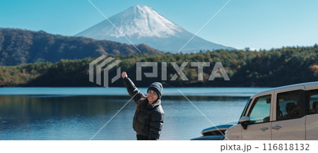 Woman tourist enjoy with Fuji Mountain at Lake Saiko, happy Traveler sightseeing Mount Fuji and road trip Fuji Five Lakes. Landmark for tourists attraction. Japan Travel, Destination and Vacation Woman tourist enjoy with Fuji Mountain at Lake Saiko, happy Traveler sightseeing Mount Fuji and road trip Fuji Five Lakes. Landmark for tourists attraction. Japan Travel, Destination and Vacation 116818132