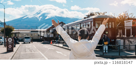 Woman tourist with Fuji Mountain at Kawaguchiko train station, happy Traveler sightseeing Mount Fuji in Yamanashi, Japan. Landmark for tourists attraction. Japan Travel, Destination and Vacation Woman tourist with Fuji Mountain at Kawaguchiko train station, happy Traveler sightseeing Mount Fuji in Yamanashi, Japan. Landmark for tourists attraction. Japan Travel, Destination and Vacation 116818147
