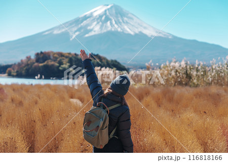Woman tourist with Fuji Mountain at Lake Kawaguchi, happy Traveler sightseeing Mount Fuji in Fujikawaguchiko, Yamanashi, Japan. Landmark for tourists attraction. Japan Travel, Destination and Vacation Woman tourist with Fuji Mountain at Lake Kawaguchi, happy Traveler sightseeing Mount Fuji in Fujikawaguchiko, Yamanashi, Japan. Landmark for tourists attraction. Japan Travel, Destination and Vacation 116818166