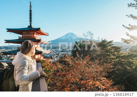 Woman tourist with mount Fuji at Chureito Pagoda in Autumn season, Traveler travel Arakurayama Sengen Park, Yamanashi, Japan. Landmark for tourist attraction. Japan Travel, Destination and Vacation Woman tourist with mount Fuji at Chureito Pagoda in Autumn season, Traveler travel Arakurayama Sengen Park, Yamanashi, Japan. Landmark for tourist attraction. Japan Travel, Destination and Vacation 116818417