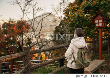 Woman tourist with mount Fuji at Chureito Pagoda in Autumn season, Traveler travel Arakurayama Sengen Park, Yamanashi, Japan. Landmark for tourist attraction. Japan Travel, Destination and Vacation Woman tourist with mount Fuji at Chureito Pagoda in Autumn season, Traveler travel Arakurayama Sengen Park, Yamanashi, Japan. Landmark for tourist attraction. Japan Travel, Destination and Vacation 116818419