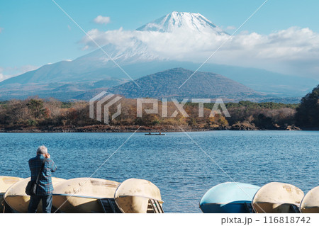 Mount Fuji at lake Shoji near Kawaguchiko, one of the Fuji Five Lakes located in Yamanashi, Japan. Landmark for tourists attraction. Japan Travel, Destination, Vacation and Mount Fuji Day concept Mount Fuji at lake Shoji near Kawaguchiko, one of the Fuji Five Lakes located in Yamanashi, Japan. Landmark for tourists attraction. Japan Travel, Destination, Vacation and Mount Fuji Day concept 116818742