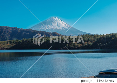 Mount Fuji at lake Saiko near Kawaguchiko, one of the Fuji Five Lakes located in Yamanashi, Japan. Landmark for tourists attraction. Japan Travel, Destination, Vacation and Mount Fuji Day concept Mount Fuji at lake Saiko near Kawaguchiko, one of the Fuji Five Lakes located in Yamanashi, Japan. Landmark for tourists attraction. Japan Travel, Destination, Vacation and Mount Fuji Day concept 116818763