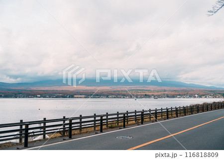 Mount Fuji at lake Yamanaka near Kawaguchiko, one of the Fuji Five Lakes located in Yamanashi, Japan. Landmark for tourists attraction. Japan Travel, Destination, Vacation and Mount Fuji Day concept Mount Fuji at lake Yamanaka near Kawaguchiko, one of the Fuji Five Lakes located in Yamanashi, Japan. Landmark for tourists attraction. Japan Travel, Destination, Vacation and Mount Fuji Day concept 116818809