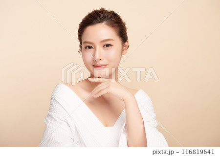 Beautiful young asian woman with clean fresh skin on beige background, Face care, Facial treatment, Cosmetology, beauty and spa, Asian women portrait. Beautiful young asian woman with clean fresh skin on beige background, Face care, Facial treatment, Cosmetology, beauty and spa, Asian women portrait. 116819641