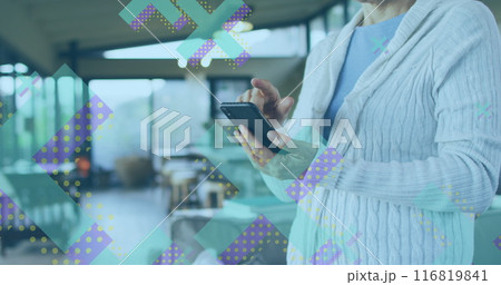 Image of x symbols over midsection of caucasian woman standing and scrolling on smartphone 116819841