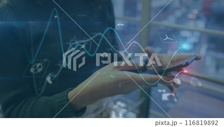 Image of graphs, icons over midsection of caucasian woman scrolling on smartphone 116819892