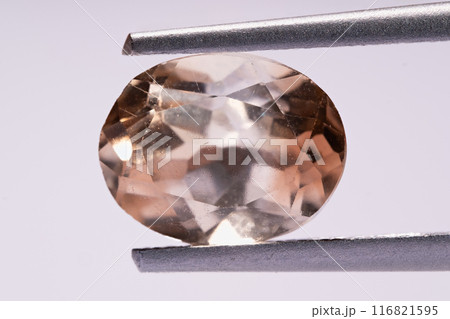 natural imperial yellow topaz gem on isolated white background 116821595