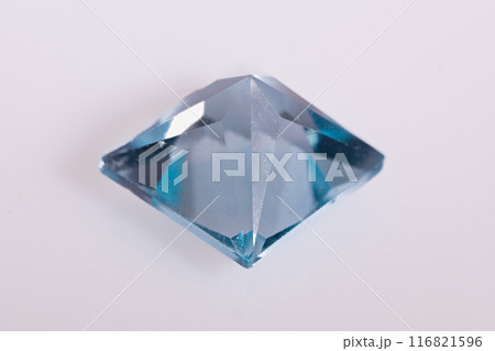 natural blue topaz gem on the isolated white background natural blue topaz gem on the isolated white background 116821596