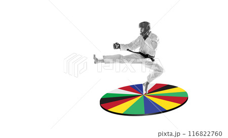 Martial artist in monochrome performing high kick over vivid circle of international flags against white background. Creative design. Art collage. Martial artist in monochrome performing high kick over vivid circle of international flags against white background. Creative design. Art collage. 116822760