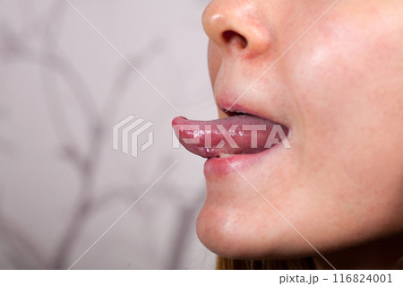 Female tongue. Close-up Of A Woman's Face Showing Her Clean Tongue Female tongue. Close-up Of A Woman's Face Showing Her Clean Tongue 116824001