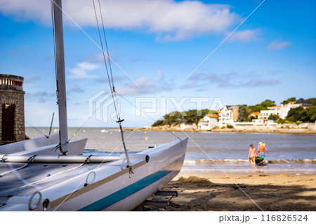 White boat on beautiful sea beach in sunny day closeup. Travel ocean transportation on scenic seascape with blurred background White boat on beautiful sea beach in sunny day closeup. Travel ocean transportation on scenic seascape with blurred background 116826524