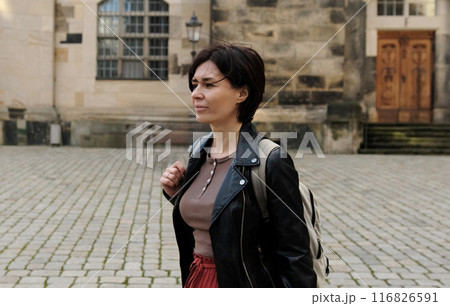 Girl Tourist, With Backpack, Explores Historical Part Of European City, Admiring Landmarks 116826591