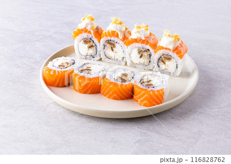 Japanese cuisine. Sushi roll on white background. Japanese cuisine. Sushi roll on white background. 116828762