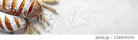 Freshly baked wheat bread loaf with wheat sprouts, on a white background. 116829142