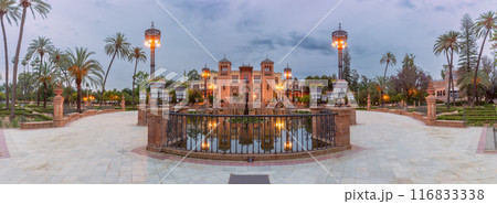 Old building in Moorish style and a pond in front of it in a park in Seville, Spain Old building in Moorish style and a pond in front of it in a park in Seville, Spain 116833338