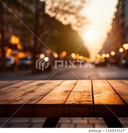 Evening scene featuring a wooden table and city lights 116833527