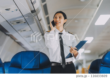 Texting on mobile chat app, Thoughtful asian people female person onboard, airplane window, perfectly capture the anticipation and excitement of holiday travel. chinese, japanese people. 116833609