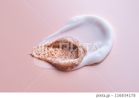 Cream and cream scrub on a pink background. Texture. 116834178