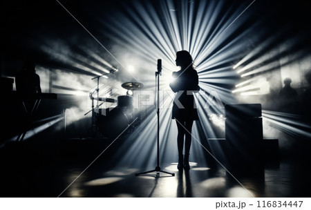 Female Singer Performing on Stage with Dramatic Lighting Female Singer Performing on Stage with Dramatic Lighting 116834447