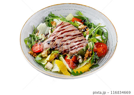 Salad with duck, oranges, and unagi sauce on a white background. isolate. for food delivery menus Salad with duck, oranges, and unagi sauce on a white background. isolate. for food delivery menus 116834669