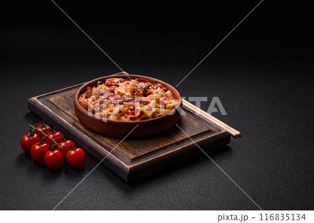 Delicious asian udon dish with vegetables, meat, salt and spices 116835134