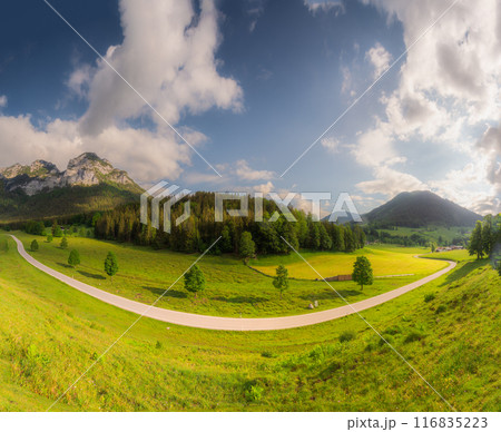 Meadow with road and bench during sunset in Berchtesgaden National Park Meadow with road and bench during sunset in Berchtesgaden National Park 116835223