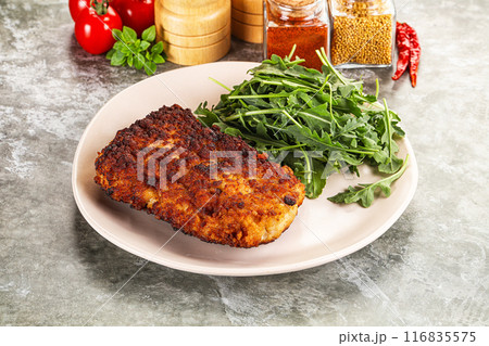 Tasty roasted breaded meat schnitzel Tasty roasted breaded meat schnitzel 116835575