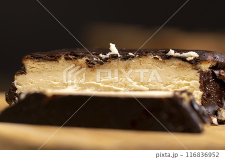 cottage cheese dessert covered with chocolate 116836952
