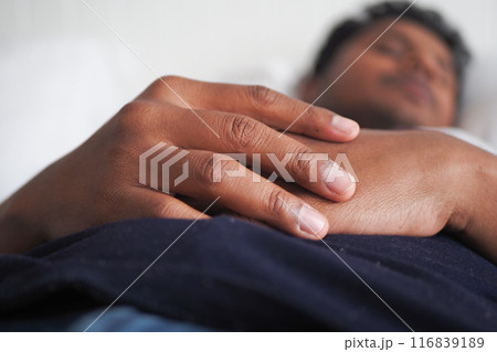 young men sleeping in bed, selective focus . young men sleeping in bed, selective focus . 116839189