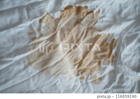 spilled coffee on a white shirt spilled coffee on a white shirt 116839190
