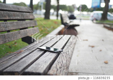 forget smartphone on a park bench, lost smart phone  116839235