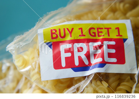 buy 1 get 1 free offer sticker and prodcuts on table  116839236