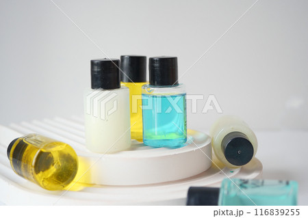 Assortment of Small Bottles with Skincare and Spa Products on Clean White Background Assortment of Small Bottles with Skincare and Spa Products on Clean White Background 116839255