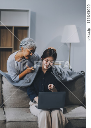 Asian elderly women and friend using social media and living room. Video streaming, happiness and conversation at a house with old people together Asian elderly women and friend using social media and living room. Video streaming, happiness and conversation at a house with old people together 116843090