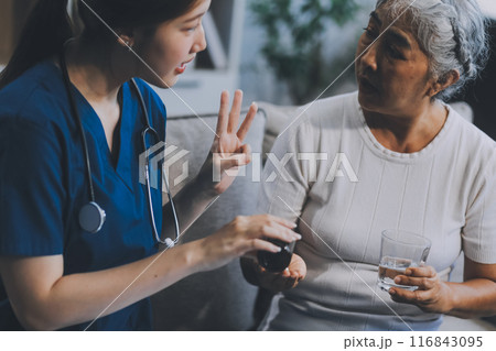 Doctor consulting with patient discussing something and Presenting results on report, Medicine and health care concept. 116843095
